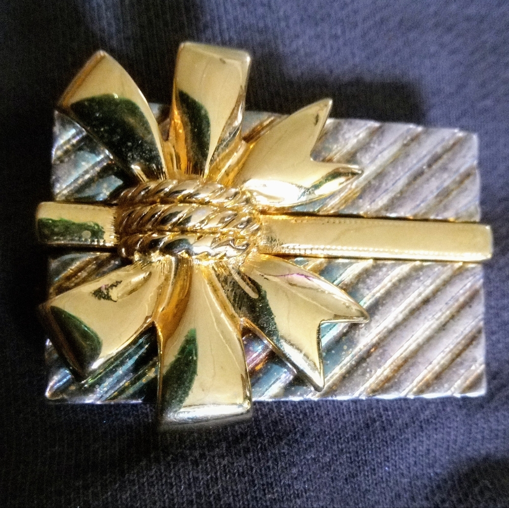 Package with bow gold tone brooch $27 branded